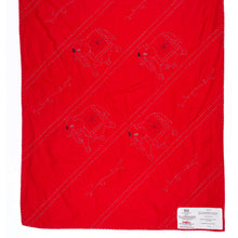Load image into Gallery viewer, Red blanket with black patterns on a white background