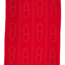 Load image into Gallery viewer, Red fabric with embroidered patterns on a white background