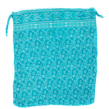 Load image into Gallery viewer, Turquoise drawstring bag with white floral pattern on a white background