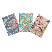 Load image into Gallery viewer, Three floral-patterned passport covers on a white background