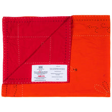 Load image into Gallery viewer, Red and orange fabric with a visible brand label on a white background