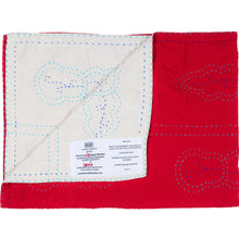 Load image into Gallery viewer, Red and white quilted fabric with a label on a white background