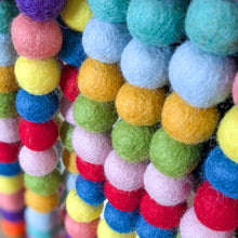 Load image into Gallery viewer, Close-up of colorful felt ball garland with various colors.