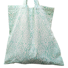 Load image into Gallery viewer, Patterned green and white tote bag on a light gray background