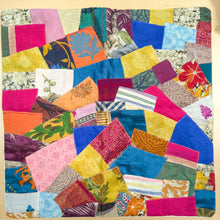 Load image into Gallery viewer, Sari patchwork cushion cover laying flat on a wooden surface