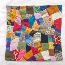 Load image into Gallery viewer, Sari patchwork cushion cover lying on a white surface
