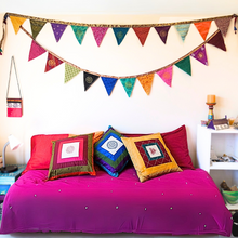 Load image into Gallery viewer, Upcycled sari flags hung above bed