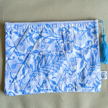 Load image into Gallery viewer, white blue block printed quilted pouch on beige surface