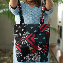 Load image into Gallery viewer, model holding up patchwork tote bag
