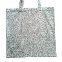 Load image into Gallery viewer, Patterned tote bag on a plain background
